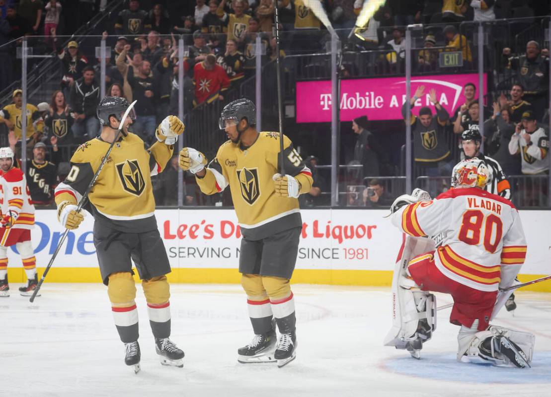 Golden Knights right wing Keegan Kolesar (55) celebrates his goal with Golden Knights center Ni ...