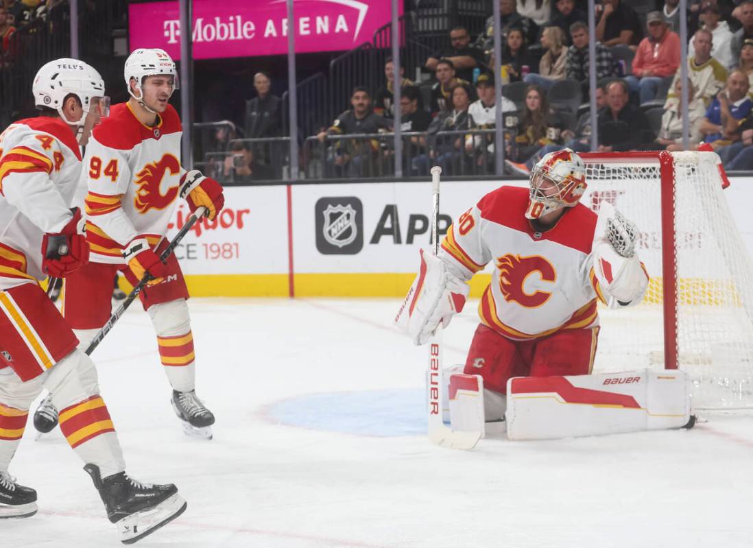 Calgary Flames goaltender Dan Vladar (80) stops the puck during the third period of an NHL hock ...