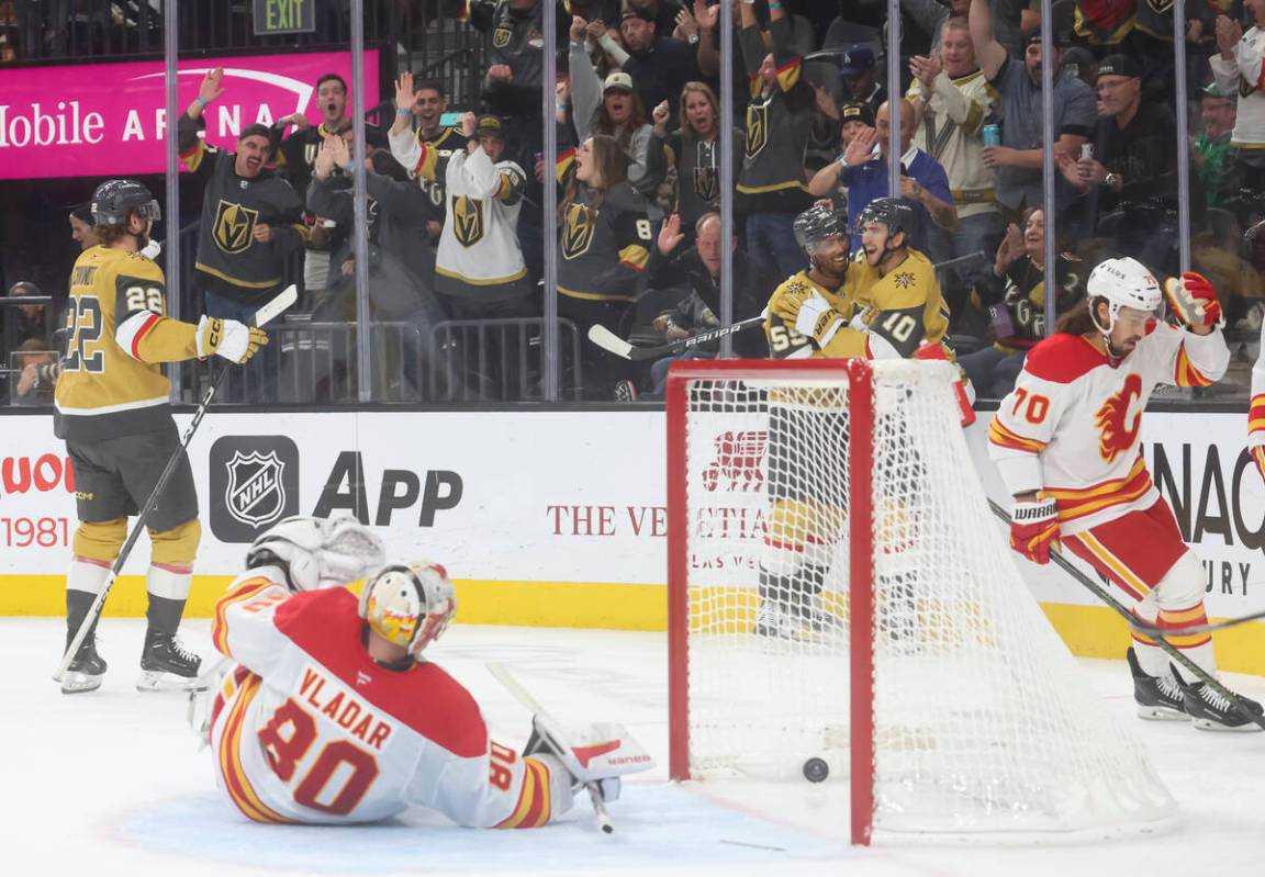 Golden Knights right wing Keegan Kolesar (55) and Golden Knights center Nicolas Roy (10) celebr ...