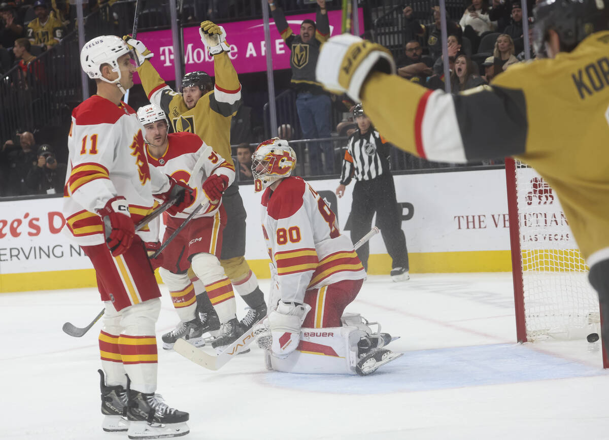 The Golden Knights celebrate after scoring against the Calgary Flames during the third period o ...