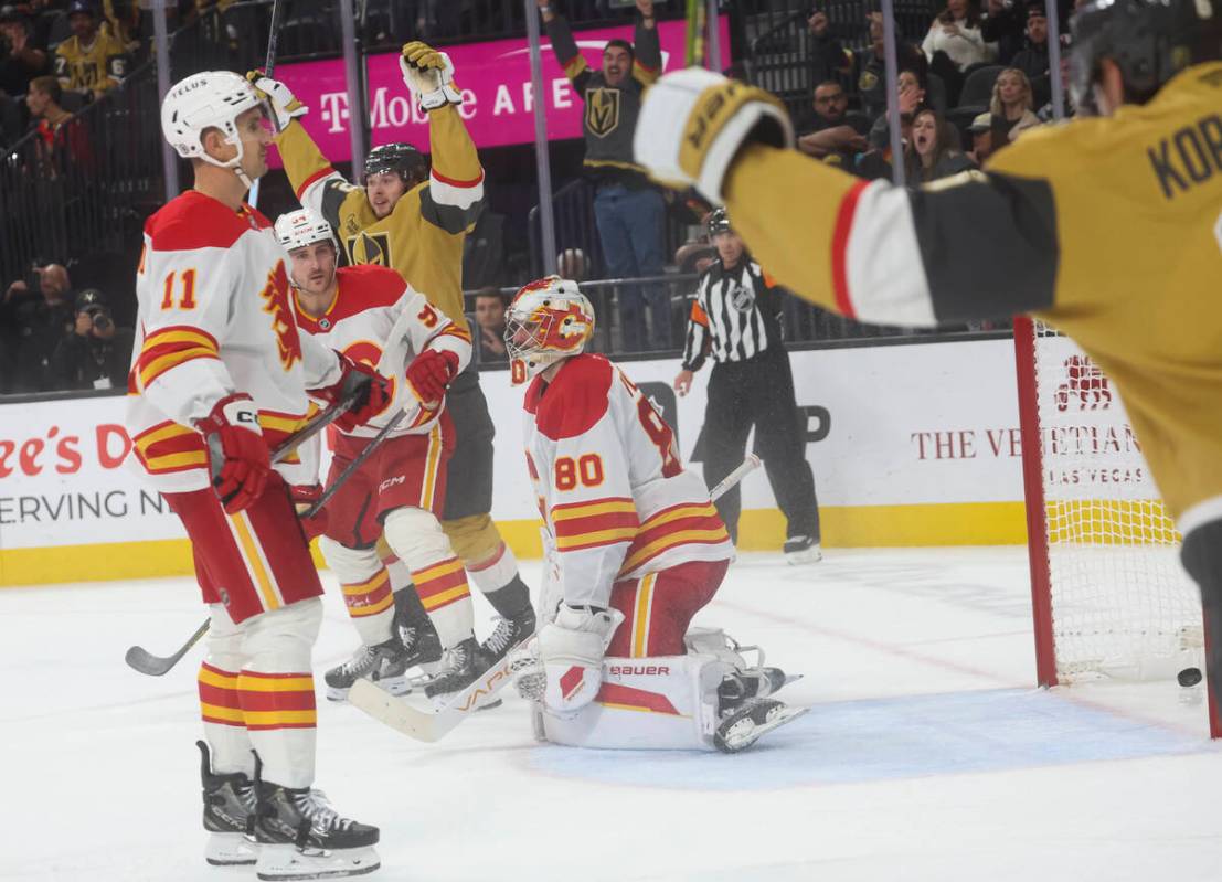 The Golden Knights celebrate after scoring against the Calgary Flames during the third period o ...