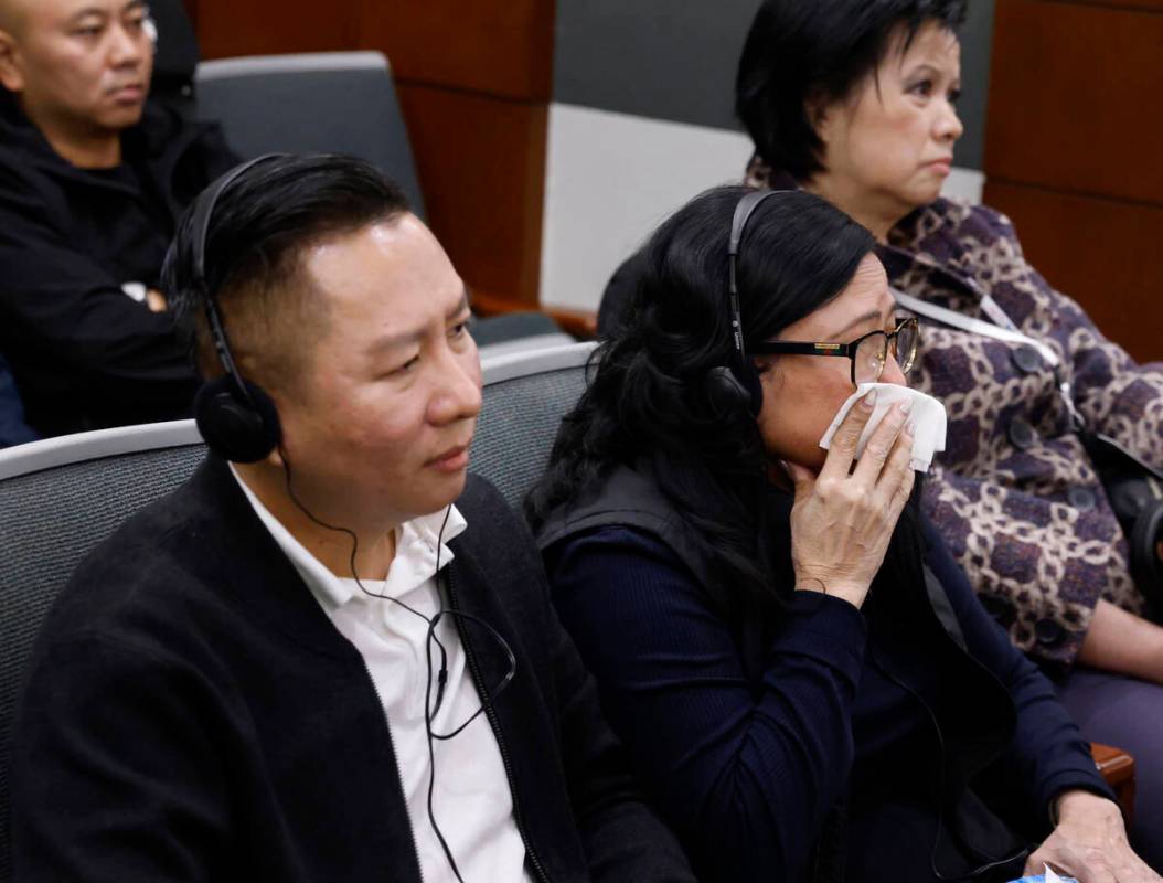 Hung Quang Nguyen, left, the husband of a stabbing victim Sang Nghia, and Bong Le, the mother o ...