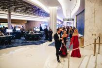 People enter the high limit room to watch the first dice roll at the Fontainebleau’s gra ...