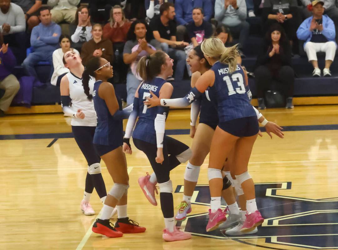 Shadow Ridge players celebrate after a play against Centennial during a Class 5A Southern Regio ...