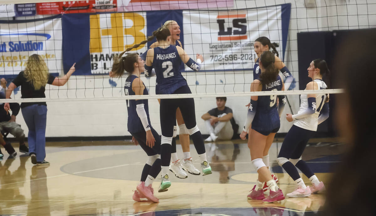 Shadow Ridge players celebrate a play against Centennial during a Class 5A Southern Region quar ...