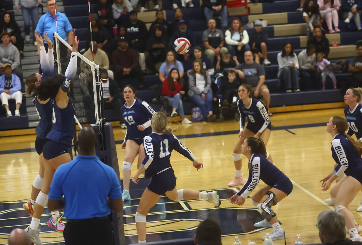 Shadow Ridge middle blocker Bree Farrimond, far left, and Lei Lasike (10) block the ball for th ...