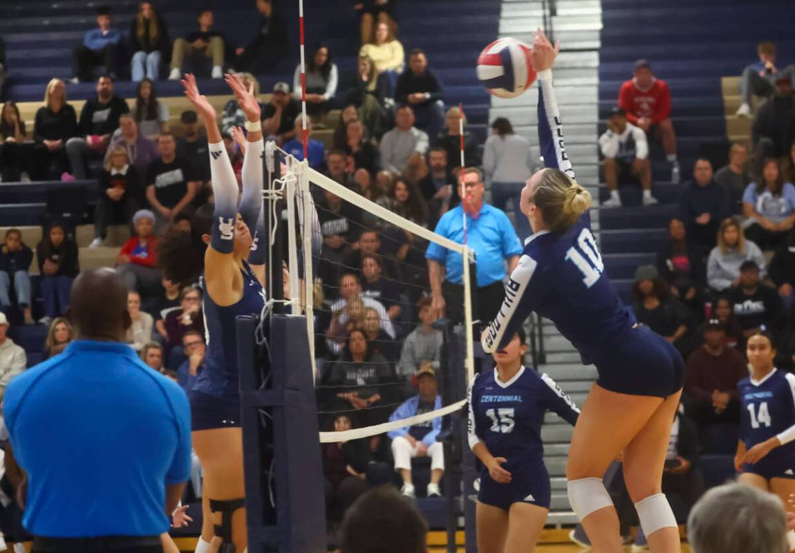 Centennial outside hitter Abby Vlaming (10) spikes the ball against Shadow Ridge during a Class ...