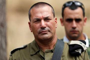 Israeli army major general Eyal Zamir, head of the southern command, looks on as he stands near ...