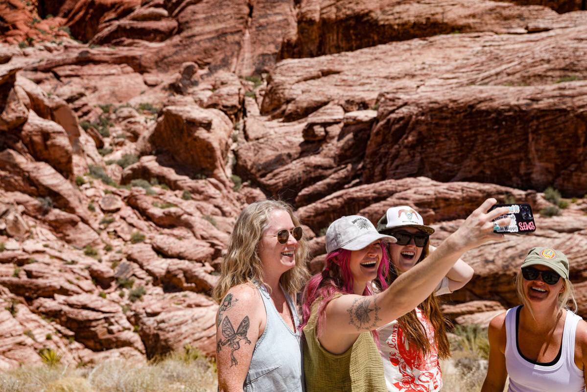 Callye Foster, from left, Katie Olson, Matt Tressler, and Jayme Hoberg, of Montana, take a self ...