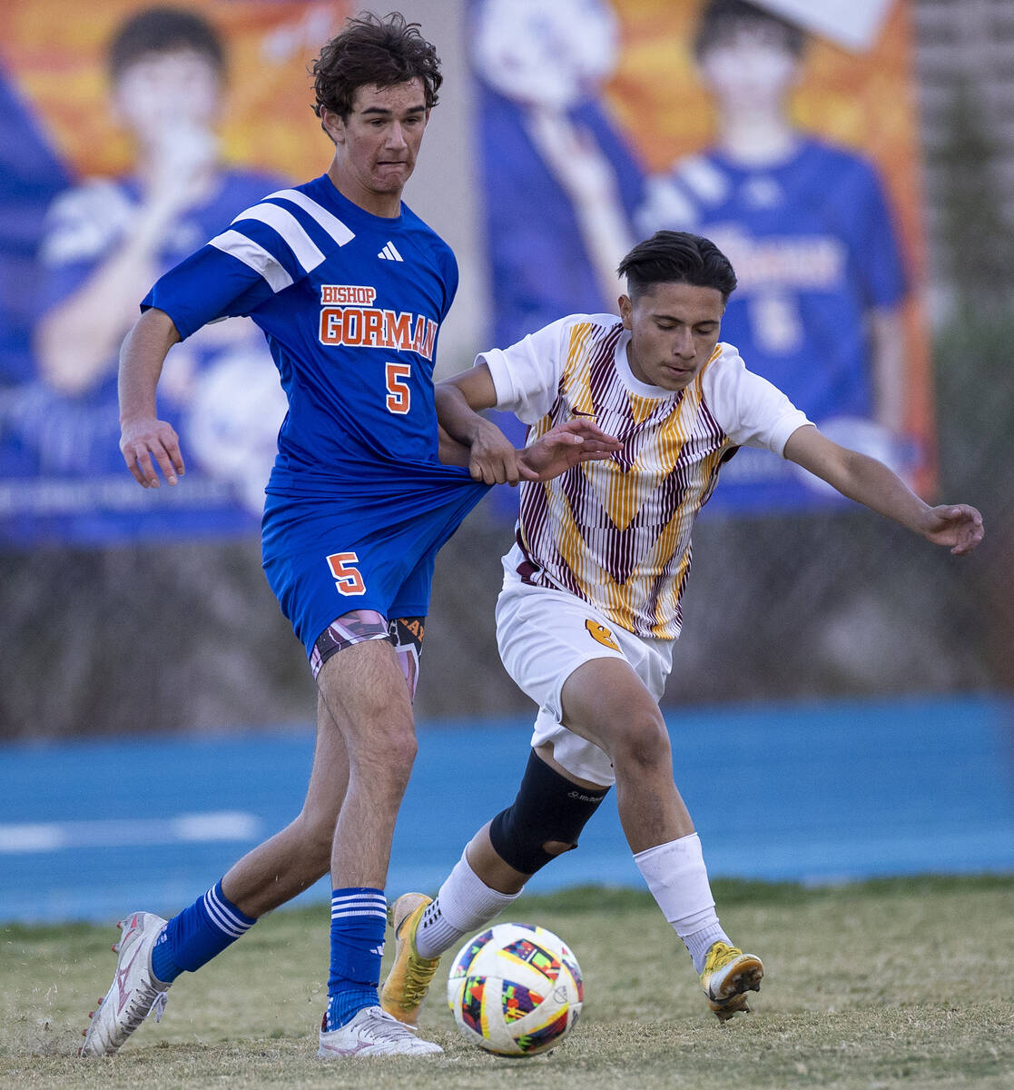 Bishop Gorman midfielder Benjamin Carpenter (5) and Eldorado sophomore Julian Suarez-Marin, rig ...