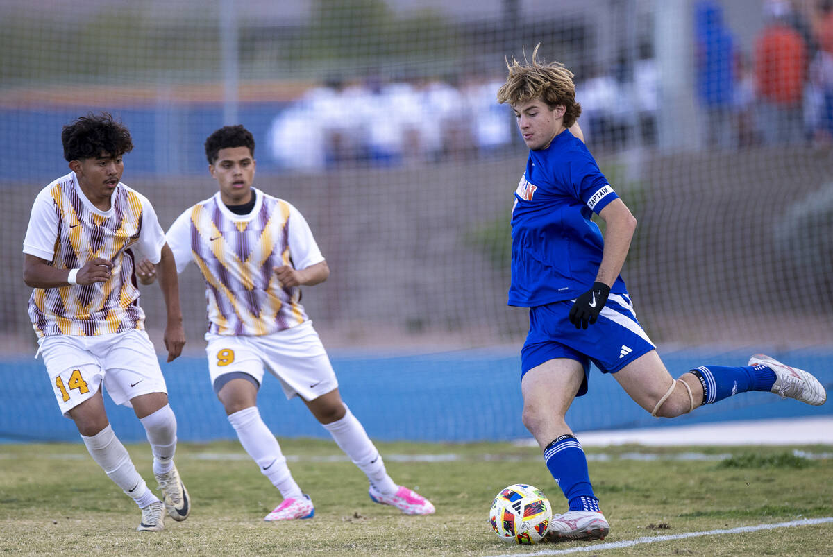 Bishop Gorman forward Chase Stewart (9) looks to kick the ball during the Class 5A Southern Lea ...