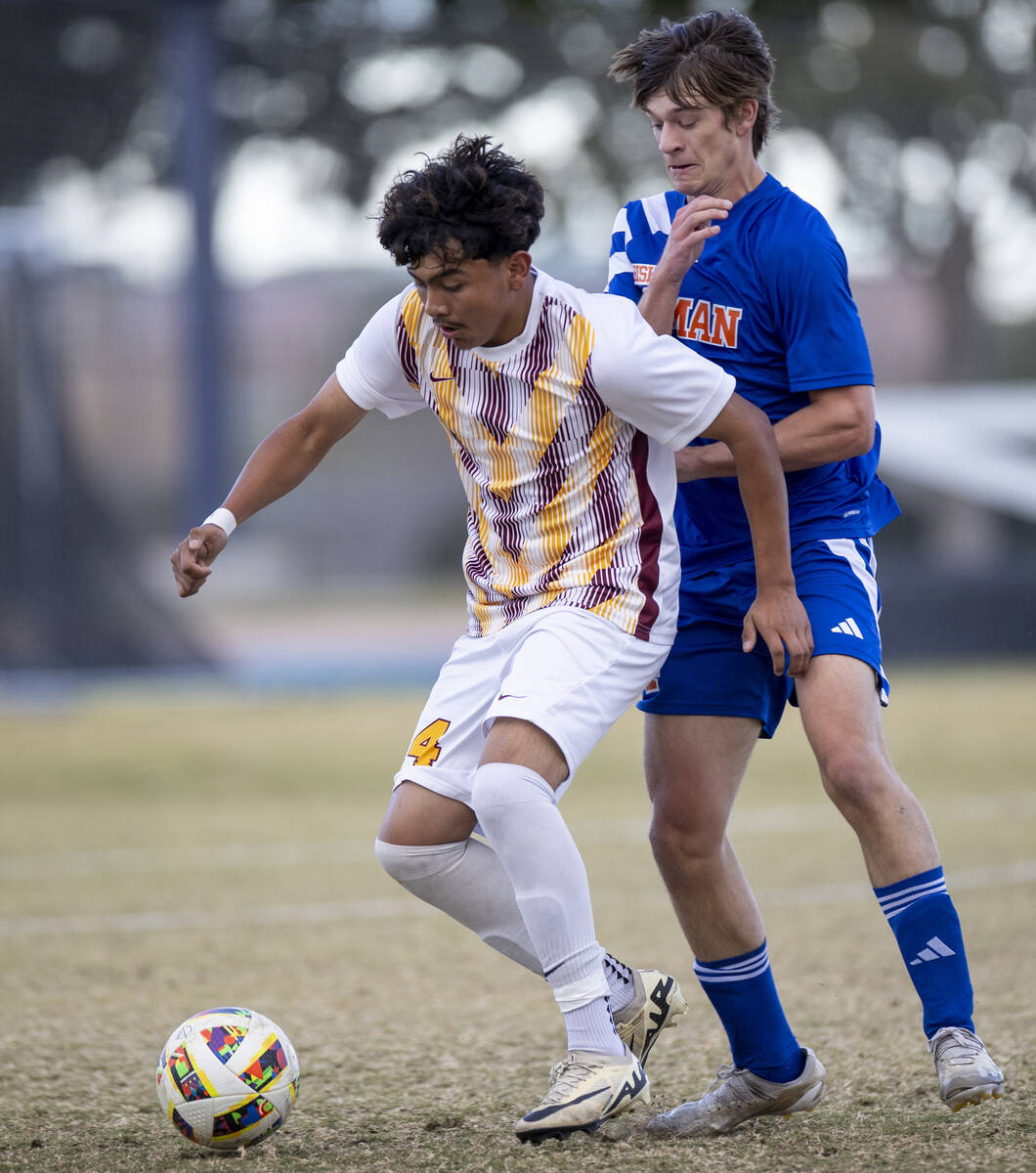 Eldorado sophomore Angel Lopez, left, and Bishop Gorman forward Alexander Rogers, right, compet ...