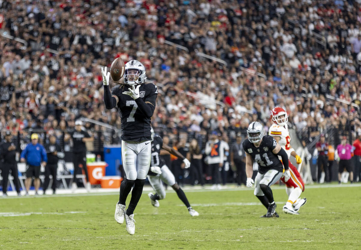 Raiders safety Tre'von Moehrig (7) intercepts the ball during the second half of the NFL footba ...