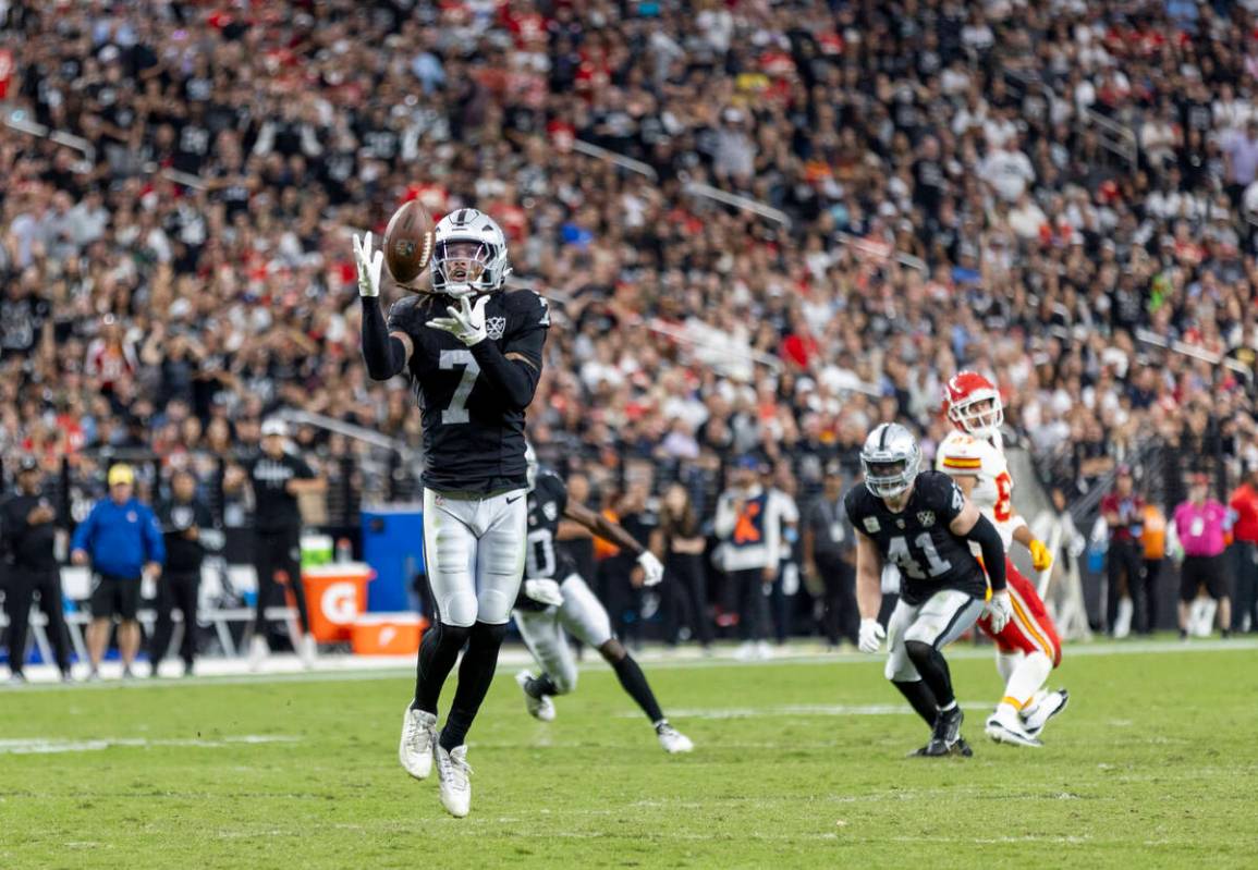 Raiders safety Tre'von Moehrig (7) intercepts the ball during the second half of the NFL footba ...