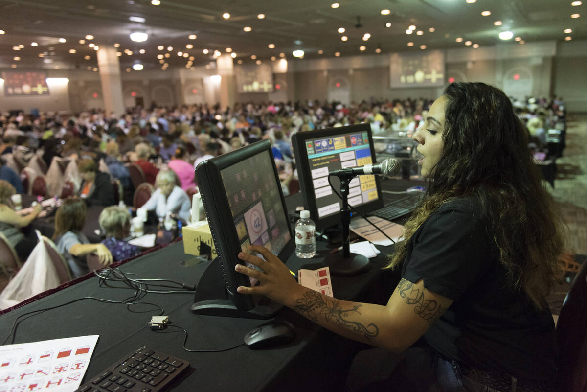 FILE - Sarah Robinette, bingo agent with the Plaza hotel-casino, calls bingo numbers during the ...