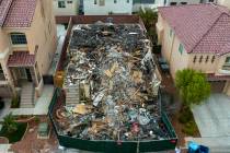 A now-demolished house that burned to the ground days before, killing two adults and two childr ...