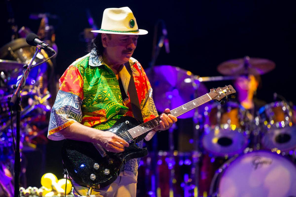 Carlos Santana performs a sound check after a press conference to announce an extension of Sant ...