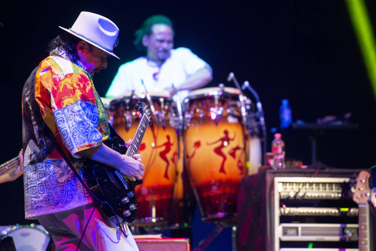 Carlos Santana performs a sound check after a press conference to announce an extension of Sant ...