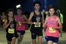 Shadow Ridge’s Carson Wetzel, right, leads the pack during the Red Rock Running Company ...