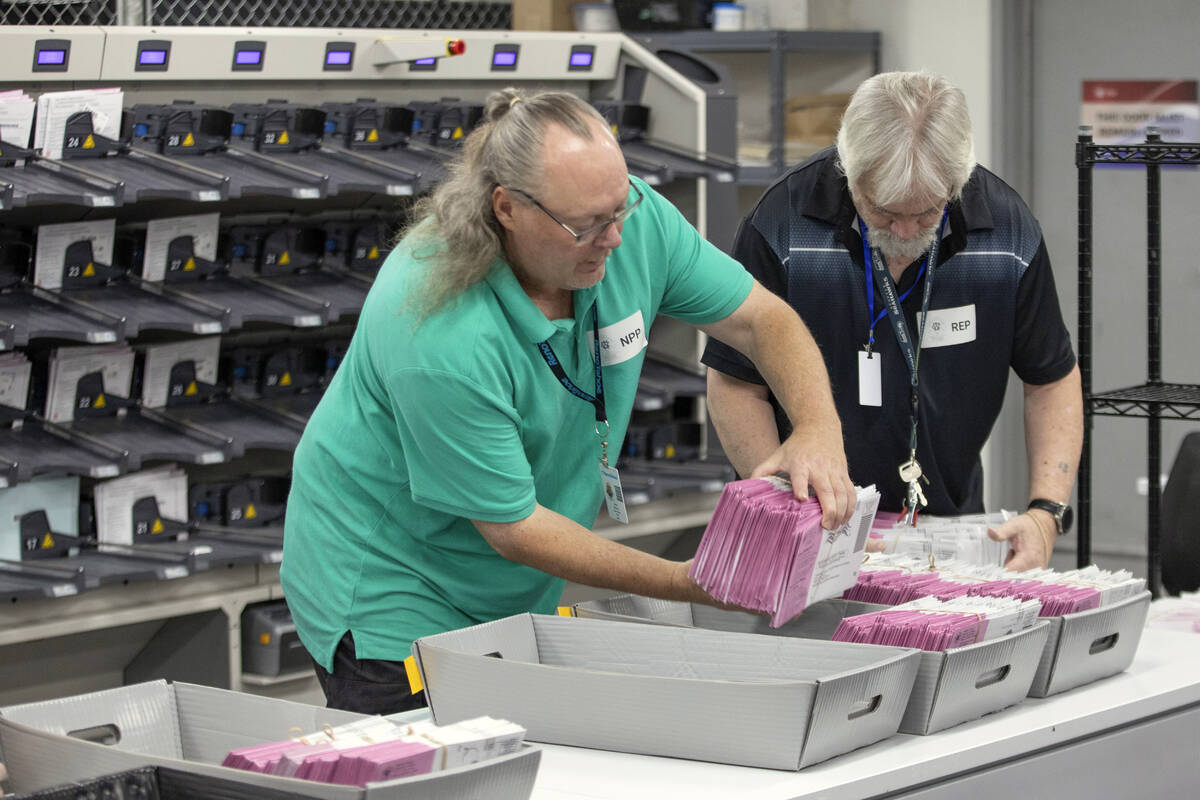 Washoe County election workers sort ballots at the Registrar of Voters Office in Reno, Nev., on ...