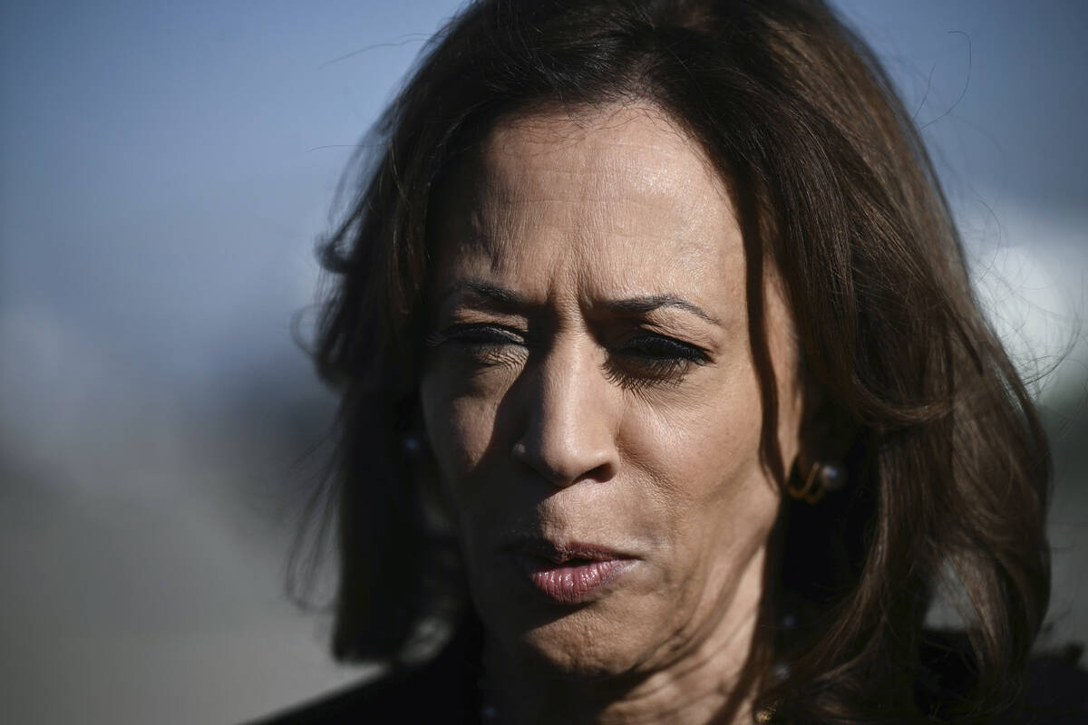 Democratic presidential nominee Vice President Kamala Harris talks to reporters before boarding ...