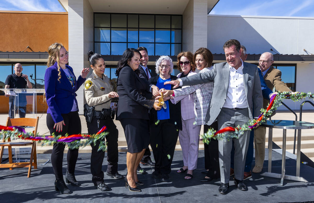 Invited dignitaries and administrators cut a ribbon during the St. Jude’s Ranch for Chil ...