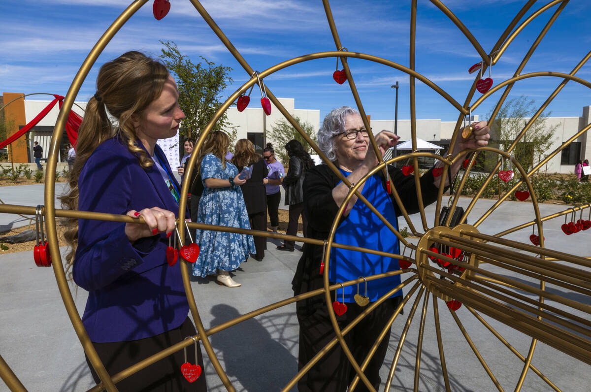 St. Jude’s Ranch for Children program development coordinator Annika Huff, left, looks o ...