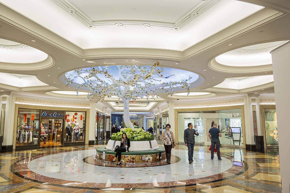 FILE - People pass through the newly renovated Grand Canal Shoppes in Las Vegas on Friday, Jan. ...