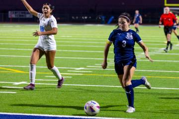 Centennial forward Natalie Sligar (3) sets up a winning goal as Canyon Springs midfielder Natal ...