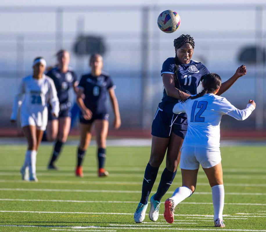 Centennial forward Natalie Penniston-John (11) heads the ball past Canyon Springs midfielder Ey ...