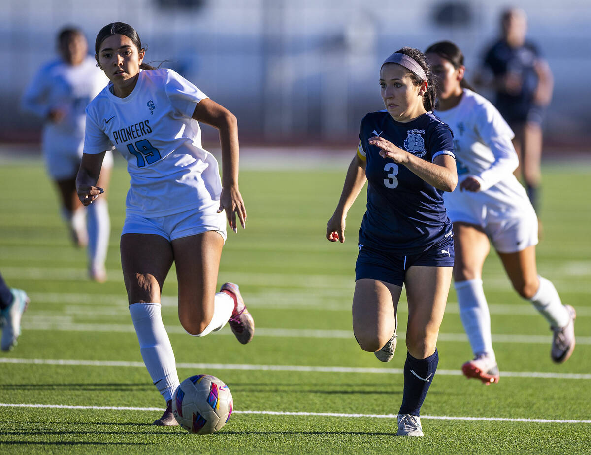 Centennial forward Natalie Sligar (3) eyes a shot on goals Canyon Springs midfielder Natalie Ro ...