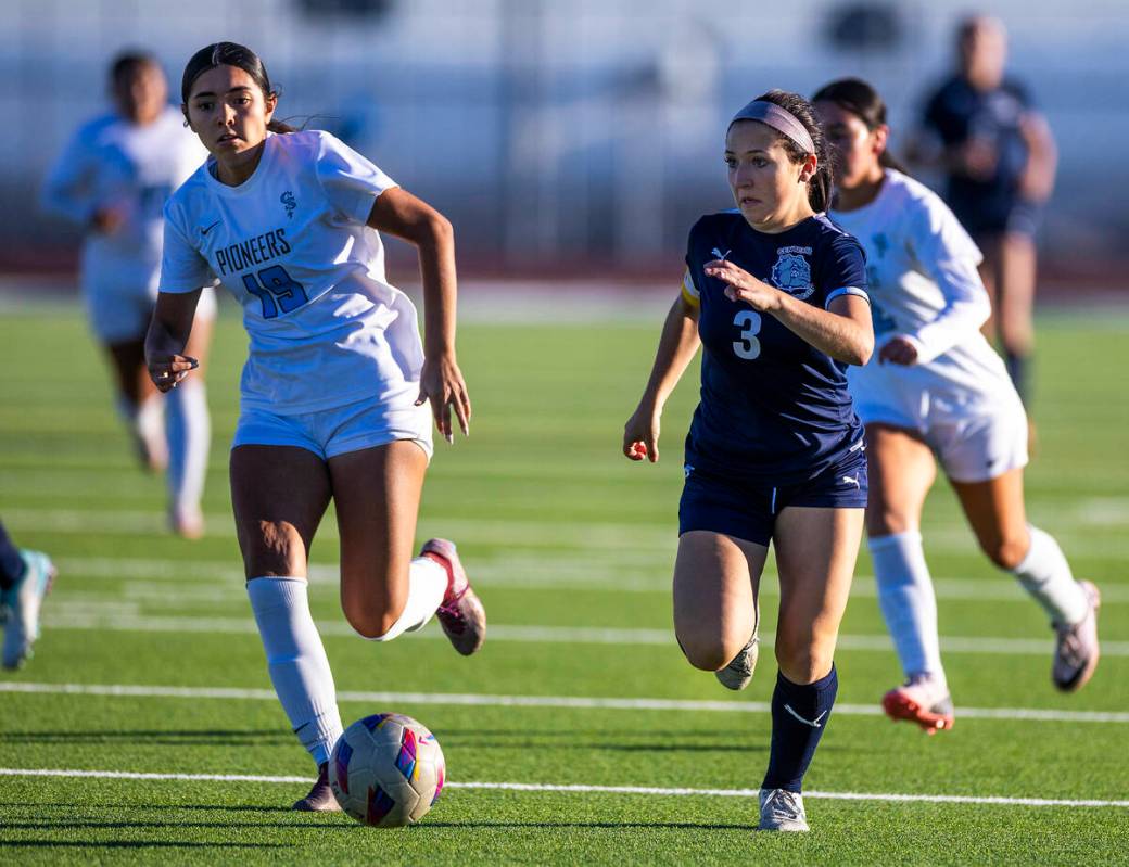 Centennial forward Natalie Sligar (3) eyes a shot on goals Canyon Springs midfielder Natalie Ro ...