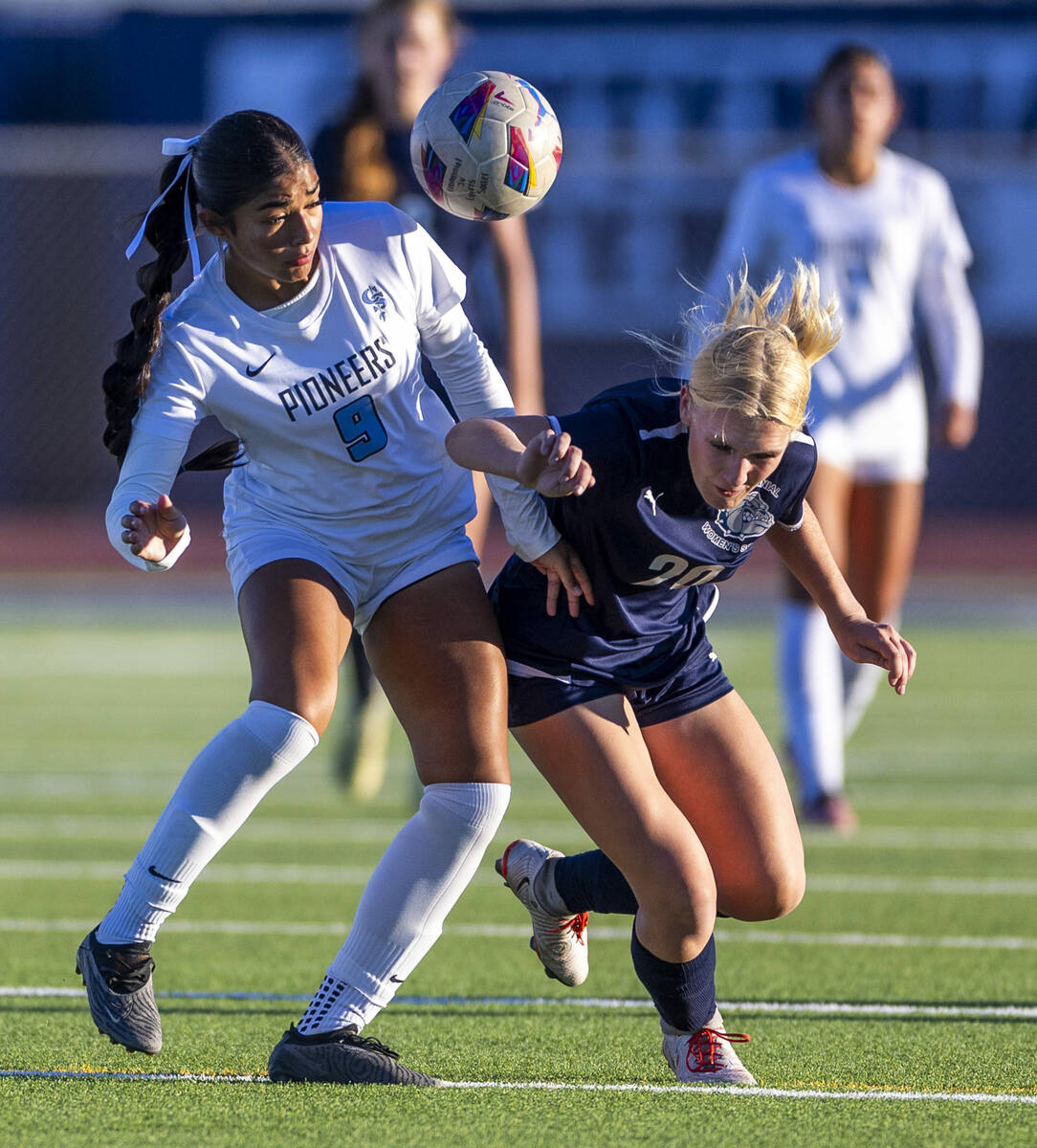 Centennial forward Skyley Mecham (20) and Canyon Springs defender Carolina Godoy (9) battle to ...