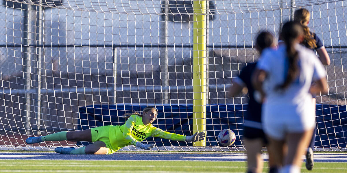 Centennial goalkeeper Madelyn Hartman (22) dives to deflect away a Canyon Springs scoring attem ...