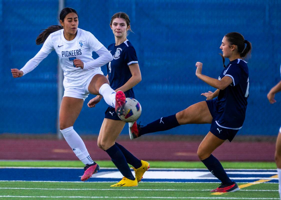 Centennial midfielder Julianne Donnelly (16) and Canyon Springs midfielder Daniela Mayorga (7) ...