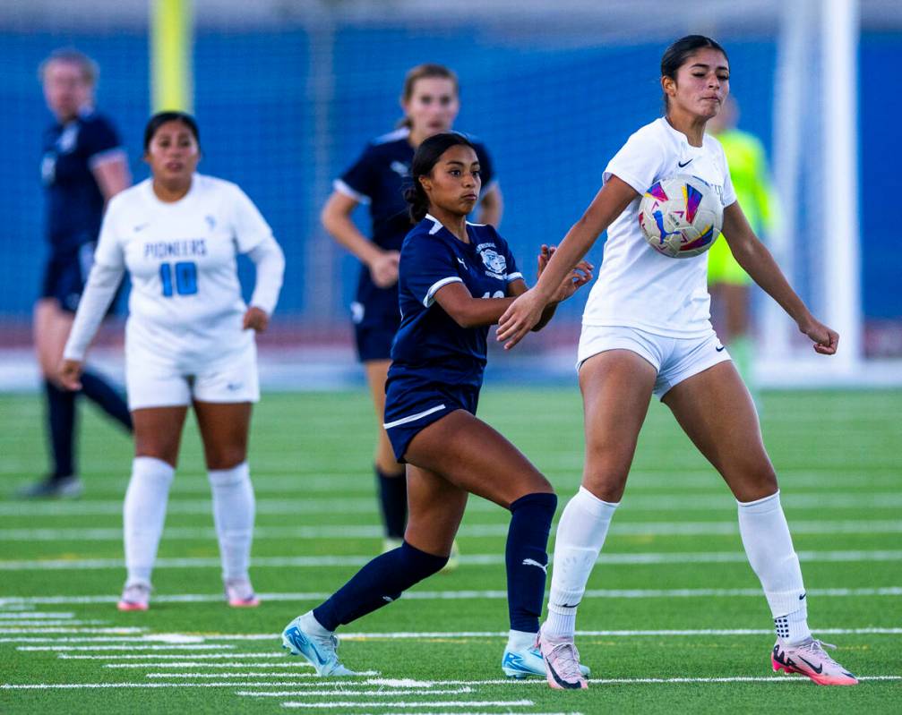 Canyon Springs midfielder Jaquelin Godoy (11) controls a ball as Centennial midfielder Alexandr ...