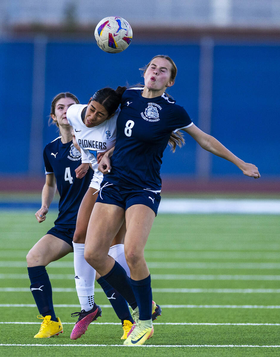 Centennial forward Claire Orme (8) and Canyon Springs midfielder Daniela Mayorga (7) collide on ...