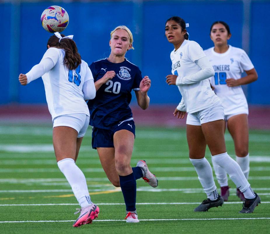 Canyon Springs defender Camila Mayorga (13) heads the ball past Centennial forward Skyley Mecha ...