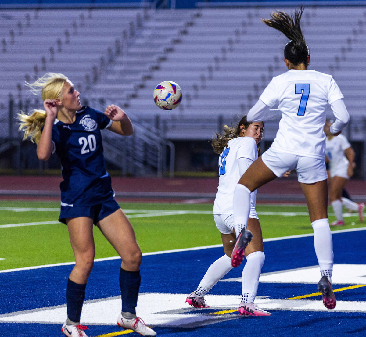 Canyon Springs midfielder Daniela Mayorga (7) heads the ball away from Centennial forward Skyle ...