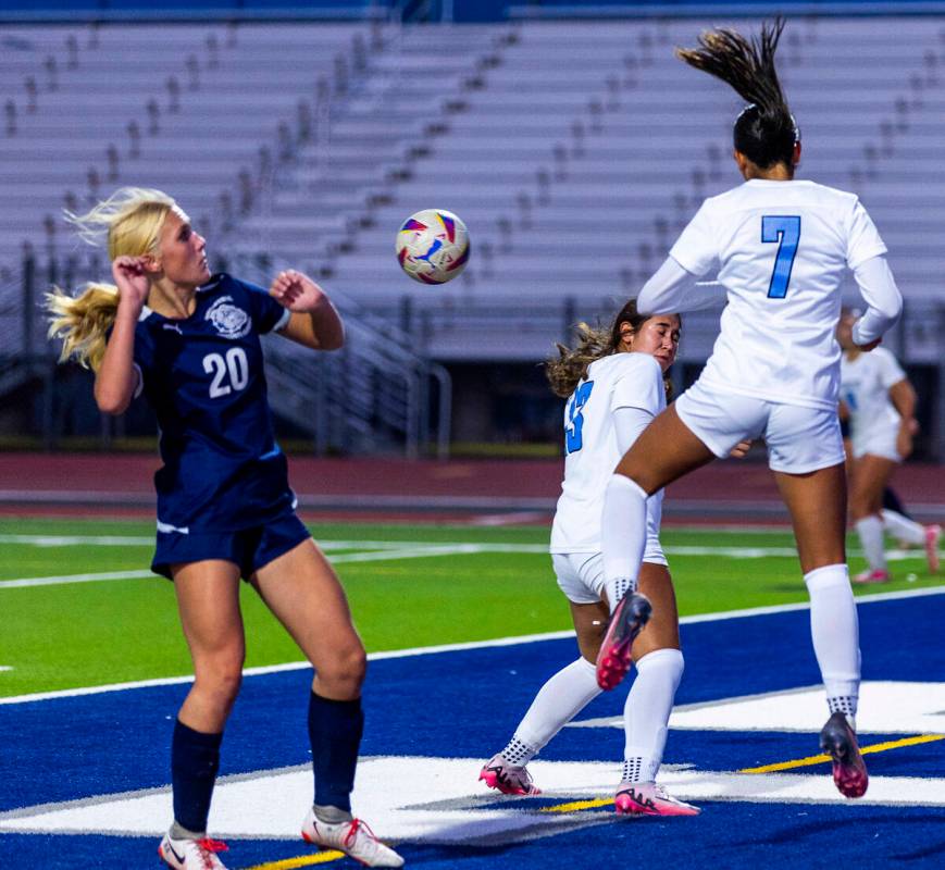 Canyon Springs midfielder Daniela Mayorga (7) heads the ball away from Centennial forward Skyle ...