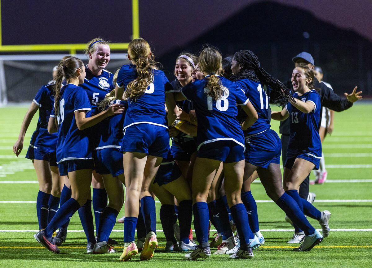 Centennial players celebrate their winning goal against Canyon Springs during the first overtim ...