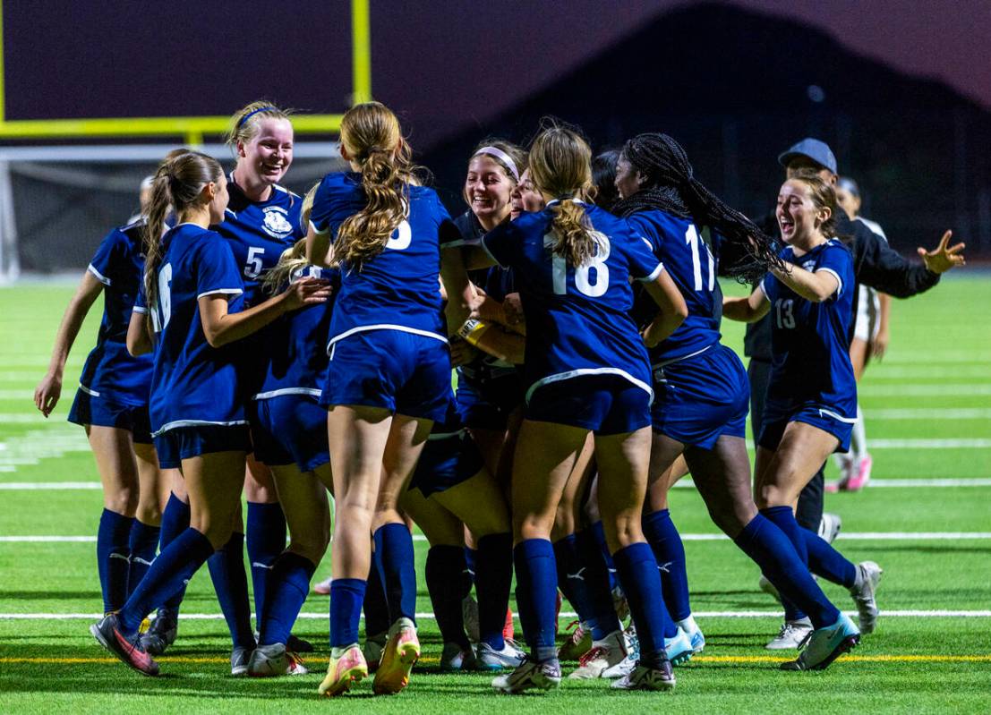 Centennial players celebrate their winning goal against Canyon Springs during the first overtim ...