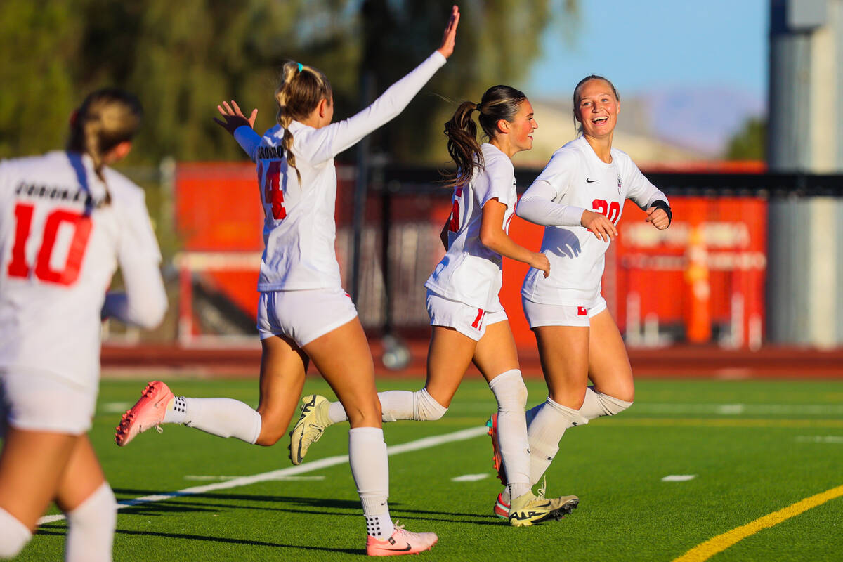 Coronado teammates celebrate a goal during a Class 5A girls soccer quarterfinals match between ...