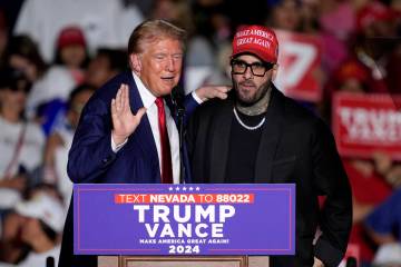 Former President Donald Trump, left, greets Nicky Jam during a campaign event at the World Mark ...