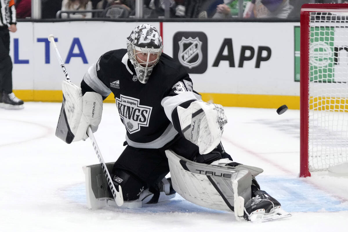 Los Angeles Kings goaltender Darcy Kuemper deflects a shot during the first period of an NHL ho ...