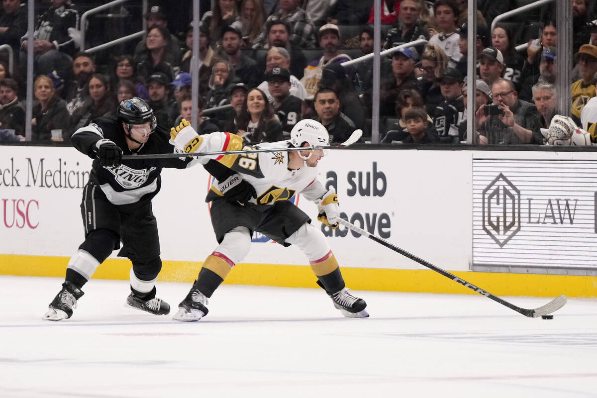 Los Angeles Kings left wing Kevin Fiala, left, and Vegas Golden Knights right wing Alexander Ho ...