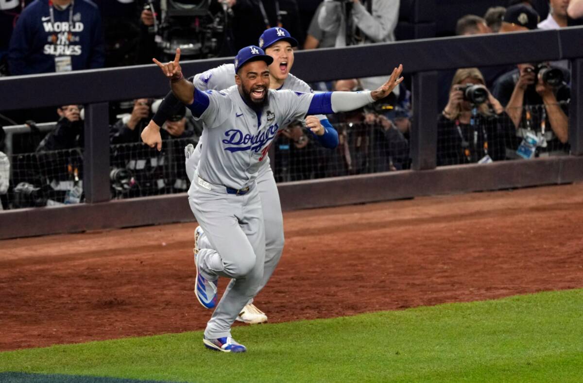 Los Angeles Dodgers' Teoscar Hernández (37) and Shohei Ohtani celebrate after the Dodgers beat ...