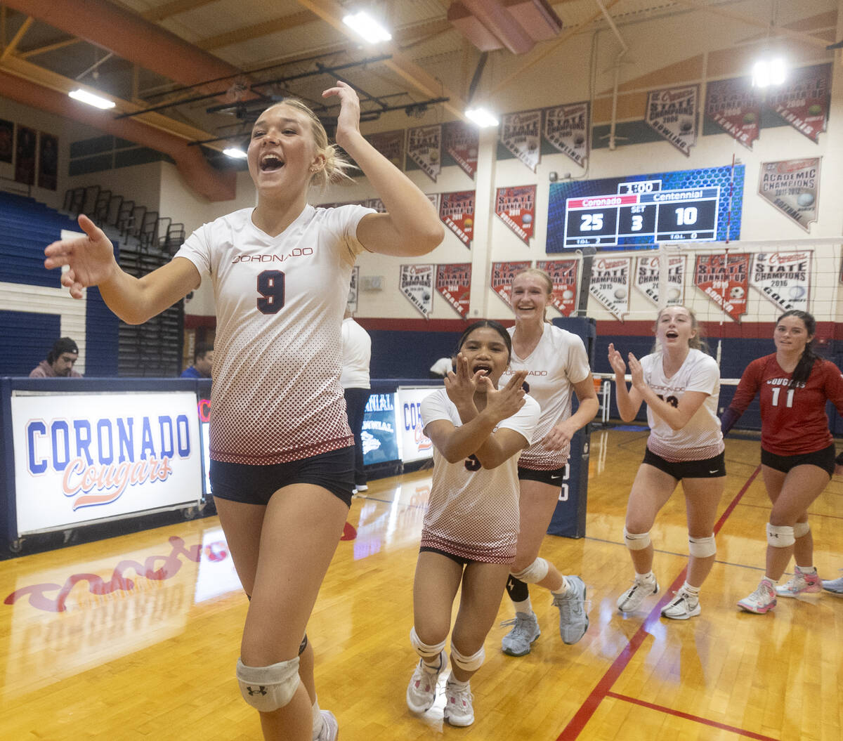 Coronado players celebrate after winning the 5A girls volleyball Southern Region semifinal 3-0 ...