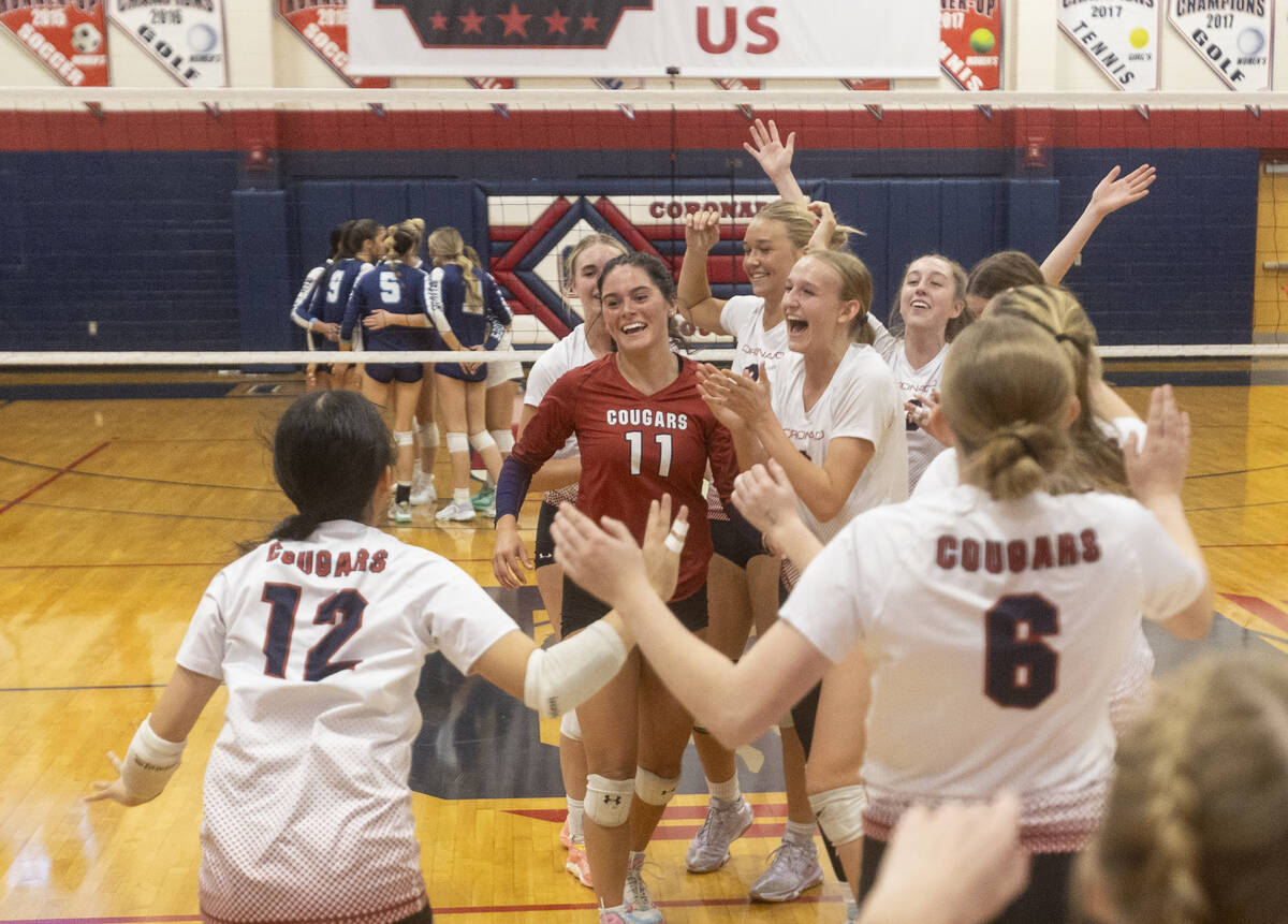 Coronado players celebrate after winning the 5A girls volleyball Southern Region semifinal 3-0 ...