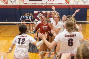 Coronado players celebrate after winning the 5A girls volleyball Southern Region semifinal 3-0 ...